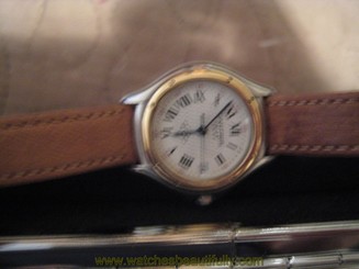 Cartier watch 18k and SS. quartz w/ date ronde ladies