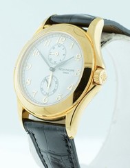 Patek Philippe Traveler 5134J gent's $27,400.00 Dual Time 18k Yellow Gold watch.