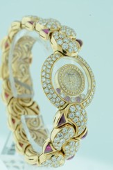 Chopard Happy Diamond and Rubies $157,000.00 ladies 18k Yellow Gold watch.